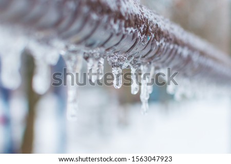 frozen icicles after rain on the pipe Foto stock © 