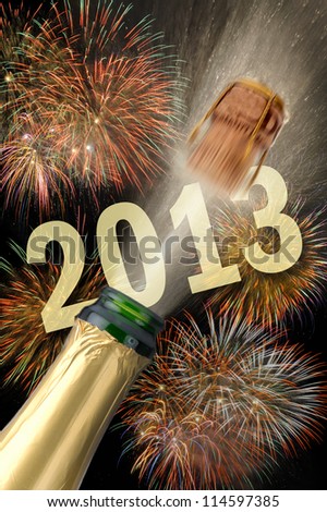 popping champagne and firework at new year 2013