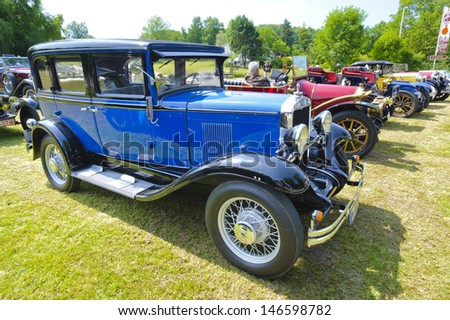 LANDSBERG, GERMANY - JULY 12: Oldtimer rallye for at least 80 years old antique cars with Chevrolet Sedan AD Universal, built at year 1930, photo taken on July 12, 2013 in Landsberg, Germany