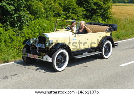 LANDSBERG, GERMANY - JULY 13: Oldtimer rallye for at least 80 years old antique cars with Oldsmobile, built at year 1924, photo taken on July 13, 2013 in Landsberg, Germany