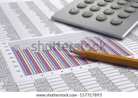 finance business calculation with calculator, chart and pencil