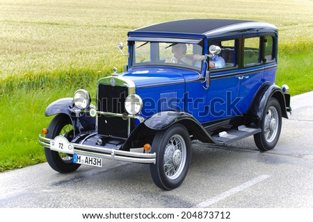 LANDSBERG, GERMANY - JULY 12, 2014: Public oldtimer rally organized by Bavarian city Landsberg for at least 80 years old veteran cars with unknown drivers in Chevrolet AD Sedan, built at year 1930