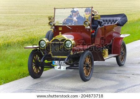 LANDSBERG, GERMANY - JULY 12, 2014: Public oldtimer rally organized by Bavarian city Landsberg for at least 80 years old veteran cars with unknown drivers in Protos F32, built at year 1909