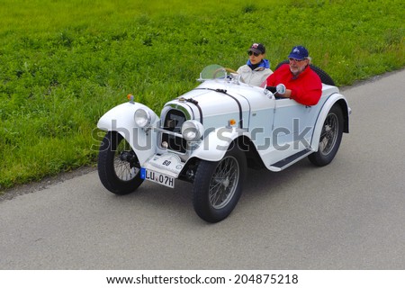 LANDSBERG, GERMANY - JULY 12, 2014: Public oldtimer rally organized by Bavarian city Landsberg for at least 80 years old veteran cars with unknown drivers in Aero 10, built at year 1929