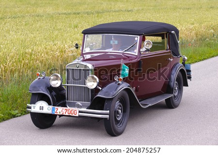 LANDSBERG, GERMANY - JULY 12, 2014: Public oldtimer rally organized by Bavarian city Landsberg for at least 80 years old veteran cars with unknown drivers in Wanderer W10 GlÃ?Â?Ã?Â¤ser, built at year 1930