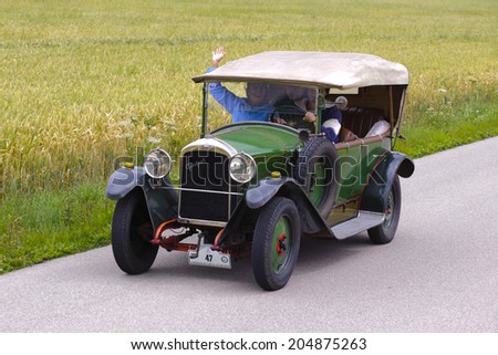 LANDSBERG, GERMANY - JULY 12, 2014: Public oldtimer rally organized by Bavarian city Landsberg for at least 80 years old veteran cars with unknown drivers in Peugeot BL 177, built at year 1923