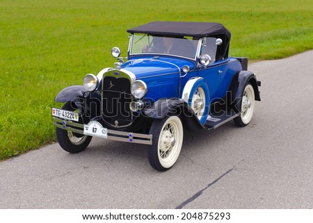 LANDSBERG, GERMANY - JULY 12, 2014: Public oldtimer rally organized by Bavarian city Landsberg for at least 80 years old cars with unknown drivers in Ford A de Luxe Roadster, built at year 1930