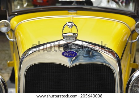 LANDSBERG, GERMANY - JULY 12, 2014: Public oldtimer rally in Bavarian city Landsberg for at least 80 years old veteran cars with a front view of Ford A Coupe, built at year 1930