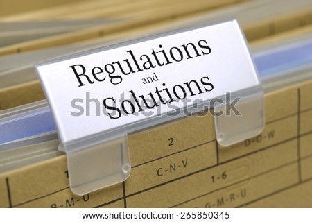 regulations and solutions printed on file folder with documents