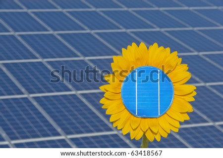 sun flower and solar panel as symbol for solar energy
