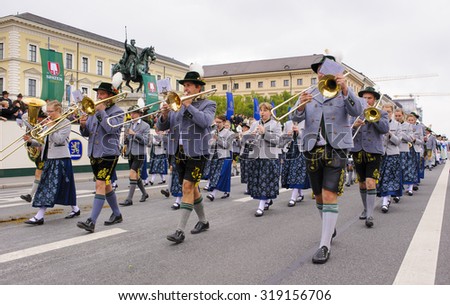 MUNICH, GERMANY - SEPTEMBER 20, 2015: The Oktoberfest is the world biggest beer festival and at the opening parade with rd. 9000 participants take part with historical costumes, music bands and horses