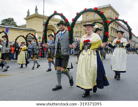 MUNICH, GERMANY - SEPTEMBER 20, 2015: The Oktoberfest is the world biggest beer festival and at the opening parade with rd. 9000 participants take part with historical costumes, music bands and horses