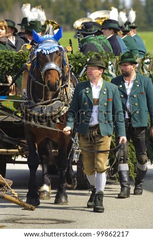 TRAUNSTEIN, GERMANY - APRIL 9: biggest annual catholic horse procession at easter, named - Osterritt - Georgiritt - in bavarian city Traunstein with 400 horses at April 9, 2012 in Traunstein, Germany