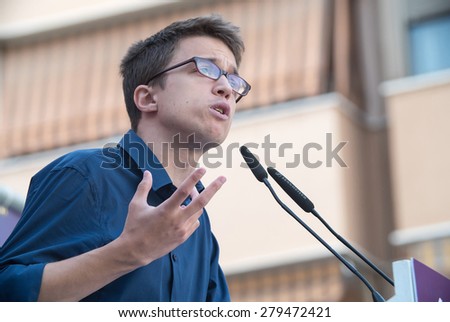 VALENCIA, SPAIN - MAY 18, 2015 : Inigo Errejon speaks at a Podemos political rally during the May 2015 election campaign. Errejon is one of the leaders of rising Spanish political party Podemos.