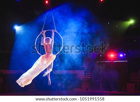 Similar – Image, Stock Photo Graceful acrobat performs with hoop on beach