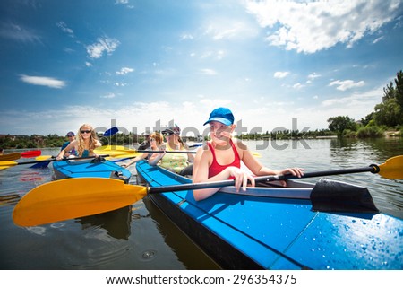A group of youths practice canoeing on the River, which runs through the city.