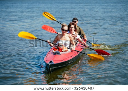 People of all ages in a kayak. Family holiday.