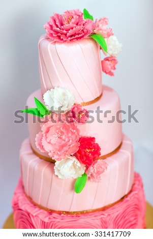 Pink wedding cake isolated on white background. Handmade Wedding Cake.