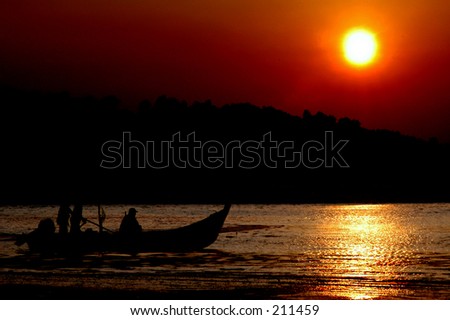 silhouette of fishermen at work during dawn