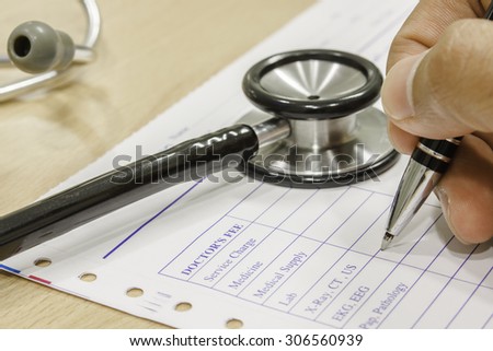 pen and stethoscope on prescription select focus of pen