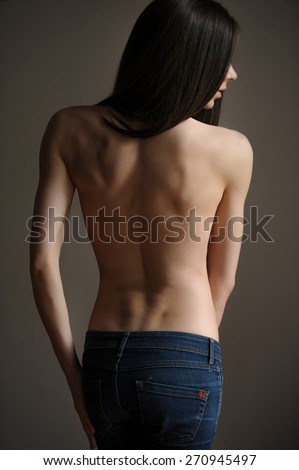 Androgynous beautiful young man, back view