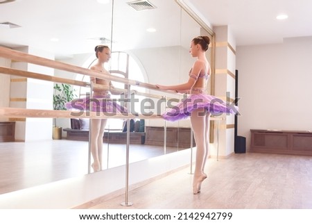 Similar – Image, Stock Photo Ballerina while she is dancing the Swan Lake.