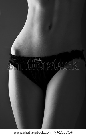 Beautiful healthy female body waist in underwear studio