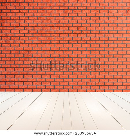 Textured red brick wall with white wooden floor inside