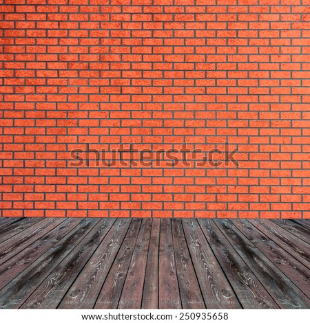 Textured red brick wall with brown wooden floor inside