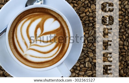 Cup of hot espresso drink on left with coffee bean background and white written word COFFEE