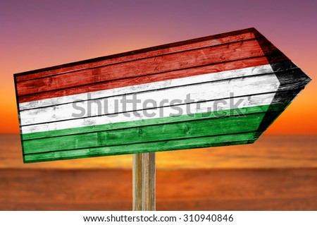 Hungary Flag wooden sign on beach background