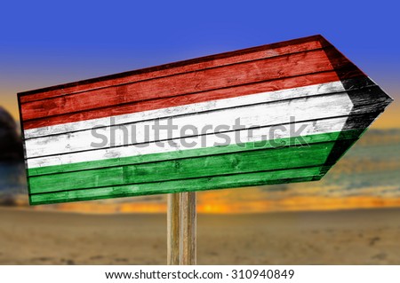 Hungary Flag wooden sign on beach background