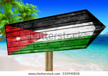 Jordan Flag wooden sign on beach background