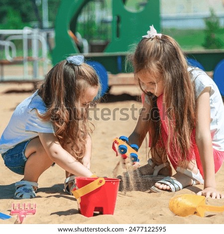 Similar – Image, Stock Photo Two little girls play on rocky northern seashore. Sit, laugh, hug, explore the coastal rocks. Travel and enjoy a great adventure in Norway. Beautiful view of fjord and mountains in sunset.