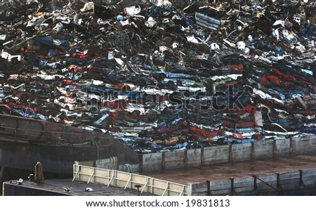 Scrap metal and cars on a big floating barge