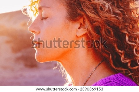 Similar – Image, Stock Photo Close up backlight portrait of a young, freckled woman with wind-blown hair in front of a bush