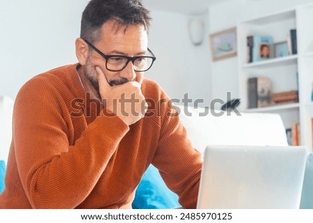 Similar – Image, Stock Photo Man using computer and programming  to break code. Cyber security threat. Internet and network security. Stealing private information. Person using technology to steal password and private data