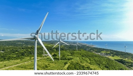 Similar – Image, Stock Photo Rotating windmill generating renewable energy wind power at land