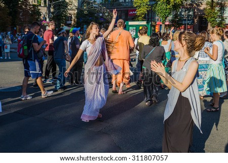 UKRAINE. KIEV - JULY 18, 2015: Krishnaites dancing on Khreshchatyk street, Kreshatik street