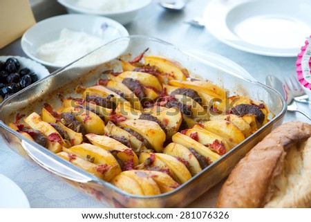 Potatoes and Meatballs in  baking-pan.