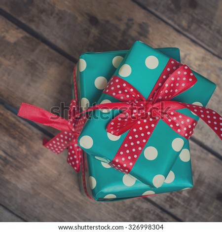 beautifully packaged gifts on wooden table. toned image