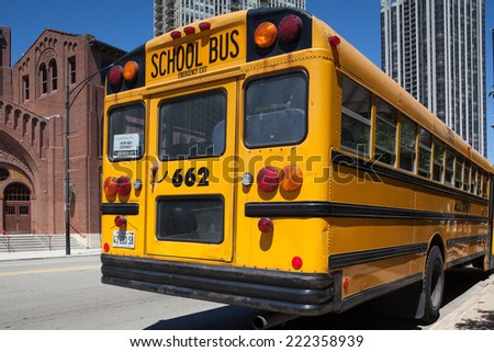 CHICAGO,USA - JULY 12,2013 : Typical american yellow school bus before the D.L.Moody memorial church and sunday school in Chicago