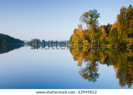 Reflection on the pond at sunset in autumn