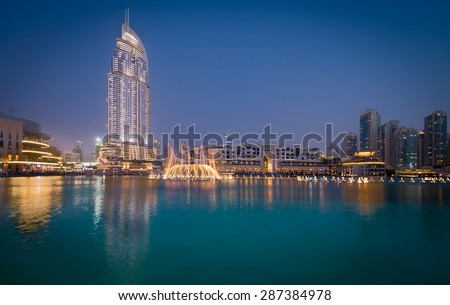 Dubai - Jun 4: The Dubai Fountain on June 4, 2015 in Dubai. The Dubai Fountain is a dancing fountain show next to the Dubai Mall and Burj Khalifa the tallest building in the world.