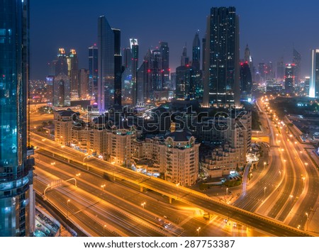 Dubai - June 5 : Dubai downtown streets and buildings near Dubai Mall and Burj Khalifa before sunrise on June 5, 2015 in Dubai.