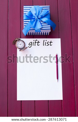 paper, pen, pocket watches and gift box