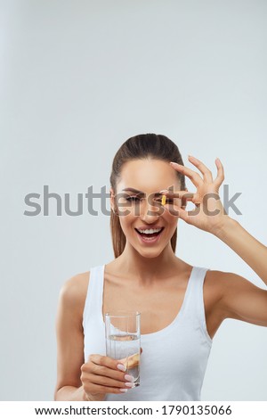 Similar – Image, Stock Photo Pretty young woman takes a break after running in the urban area