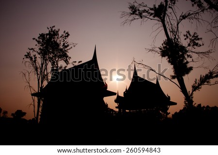 Silhouette picture of Thai house with sunset