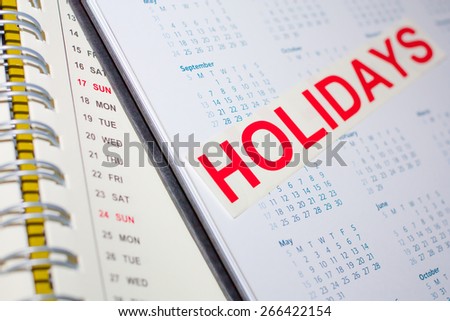 Holidays word on the calendar