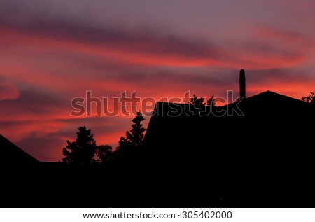 Silhouette of houses at sunset